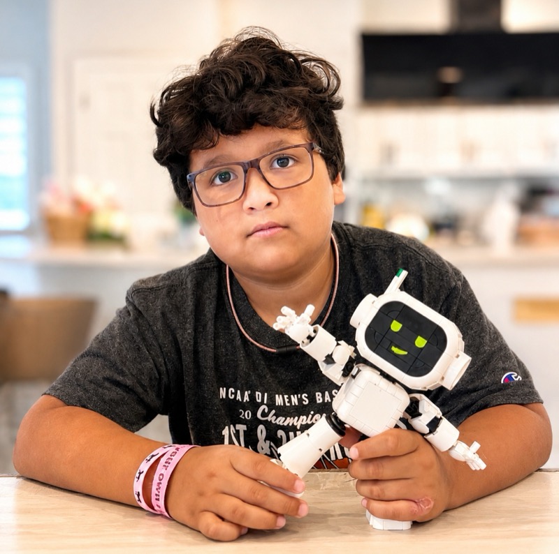 A builder holding the robot he made